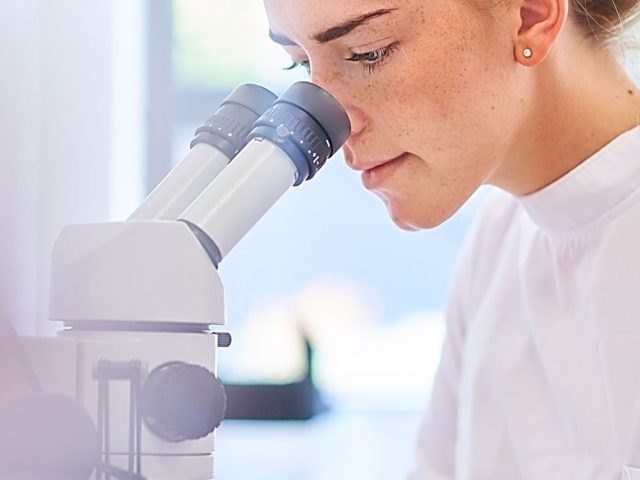 Oncofertility Network Women looking into microscope